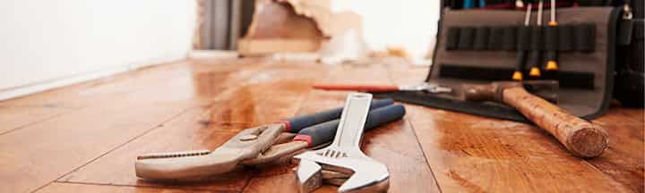 water damage repair tools on a water damaged hardwood floor in Little Rock, AR
